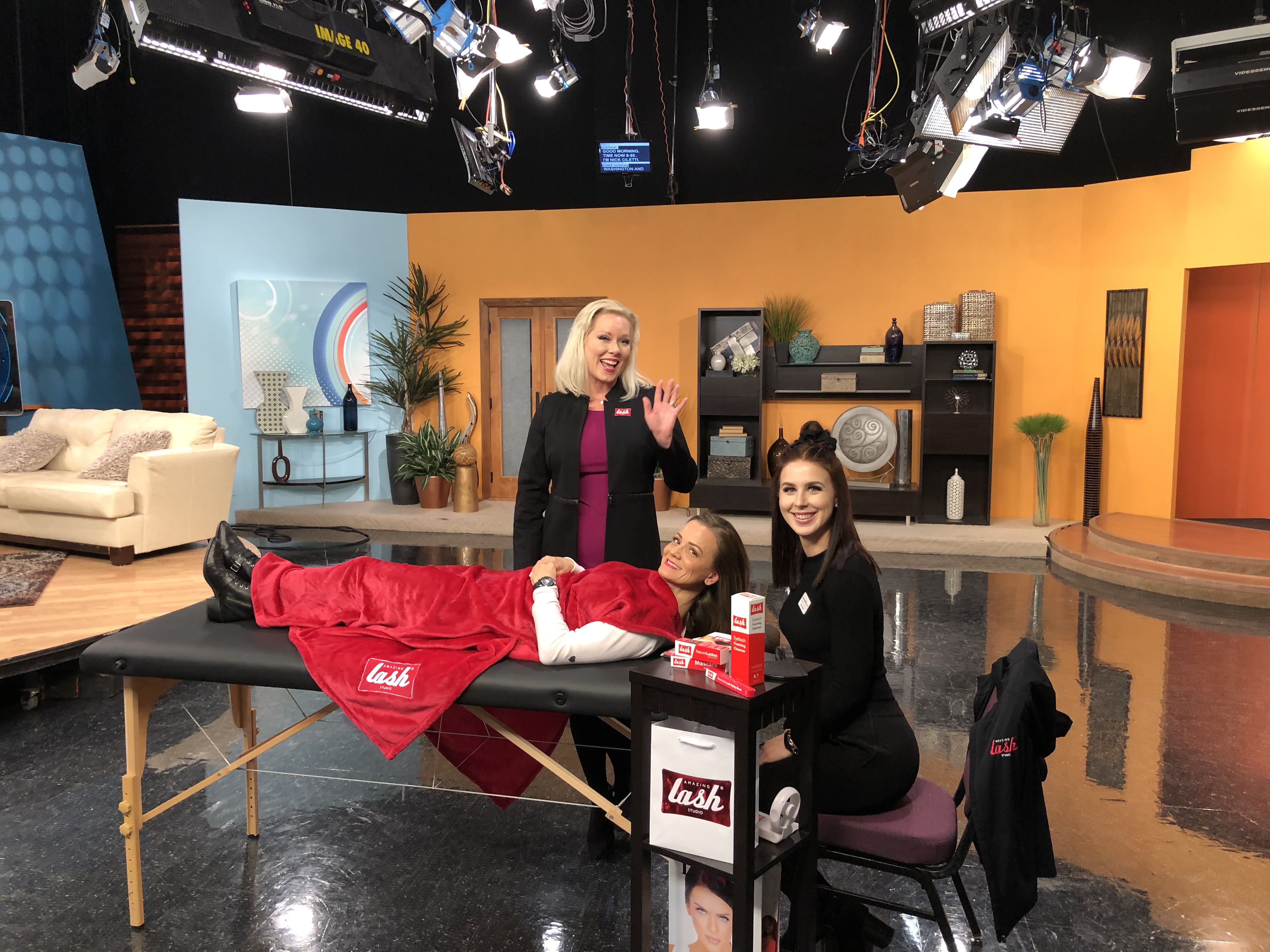 Stylist and Client on a table with CEO on TV studio set
